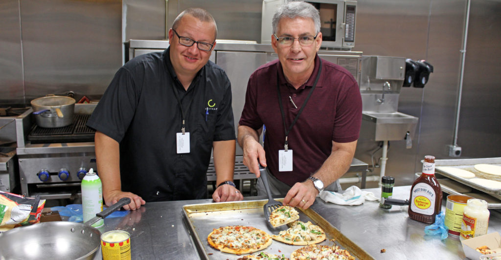 Matt and Michael with finished pizzas